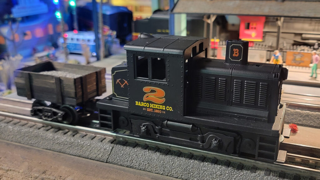 Scratch built O-Gauge Ore Cart made from a K-line truck and coffee stir sticks 