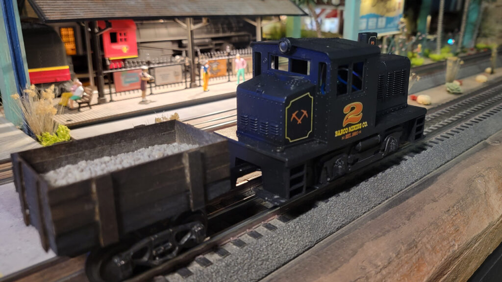 Scratch-built O-Gauge Ore Cart made from a K-line truck and coffee stir sticks
